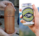 Copper-colored antique beverage container pictured beside Sparkling CBD Ginger Ale can