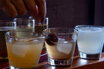 Assorted cocktails on wooden bar