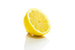 Half of single lemon fruit on white surface with sliced middle facing upward 