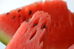 Watermelon slices with black seeds